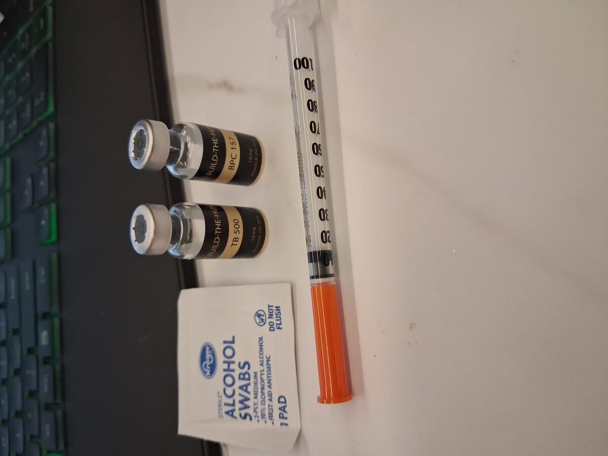 BPC-157 and TB-500 vials with syringe